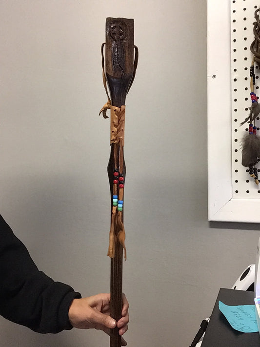 Handcrafted Wooden Walking Stick (56" length with a wood carved handle) by Sidney Nadjiwon.